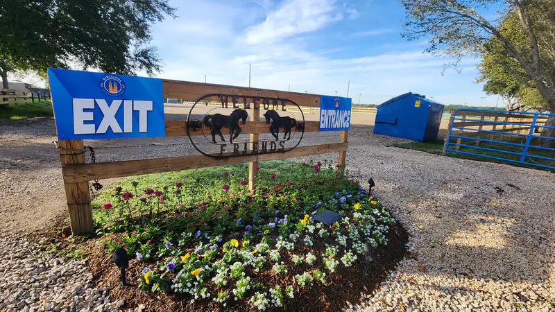 Landscaped exit sign at the campus entrance