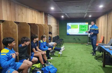 Players in a media room classroom session