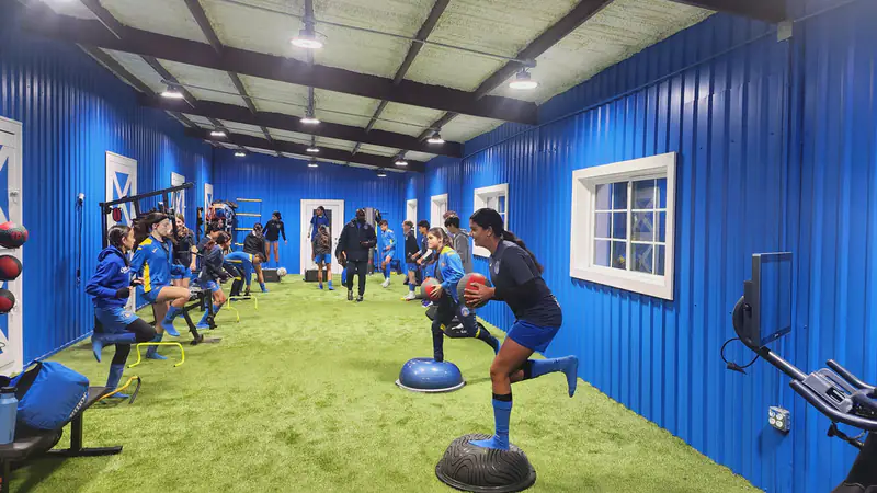Players doing balance work in the fitness center