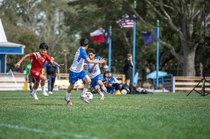 Players in a small-sided game on the campus grass fields